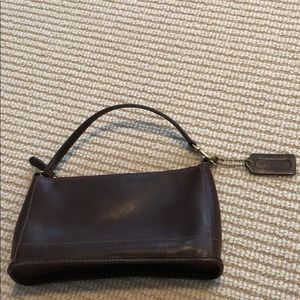 Adorable coach brown leather with accent stitching